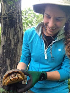 Anyah Preston holds a turtle during her internship